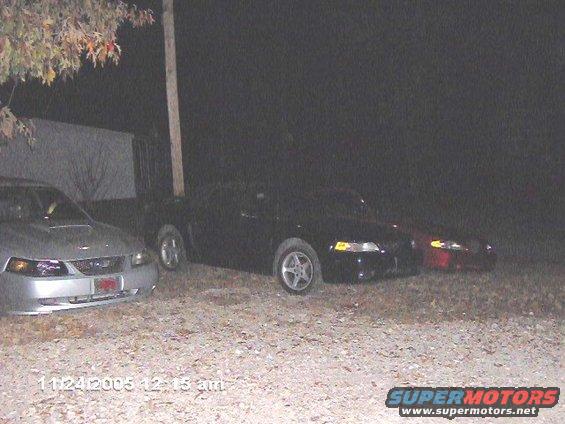 Silver 1999 Ford Mustang front view, parked at night