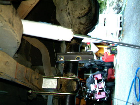Rear axle U-bolts and shock mount bracket on a vehicle