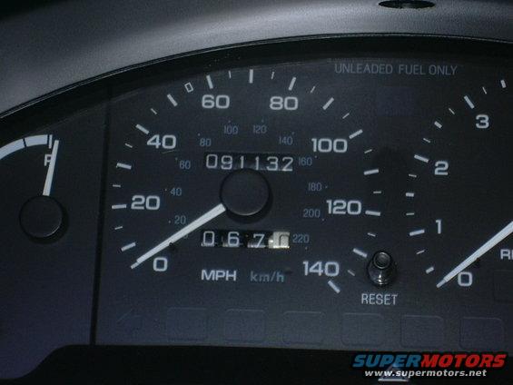 Close-up of a car's speedometer and odometer. Speedometer reads 0 MPH, odometer shows 91,132 miles