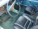 1993 Ford Bronco - Interior view shows black leather seats and teal carpeting, with a Dodge steering wheel.