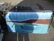 1993 Ford Bronco - Interior view of a car door panel with blue vinyl and woodgrain trim.
