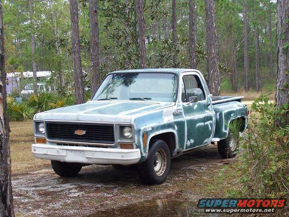 Blue and white 1974 Chevrolet C/K Pickup truck parked outdoors