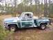 1974 Chevrolet C/K Pickup - This 1974 Chevrolet C/K Pickup truck is seen from the side, showing its green paint with areas of primer.