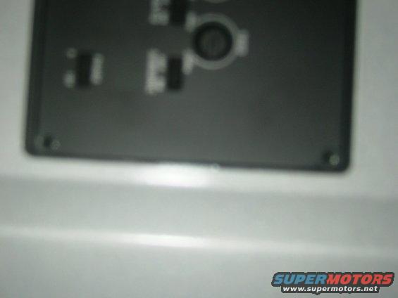 Dashboard panel with buttons and a circular dial