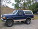 1992 Ford Bronco - This 1992 Ford Bronco is shown from the side, a two-tone blue and tan paint scheme.