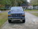 1992 Ford Bronco - Front view of a 1992 Ford Bronco parked on a concrete driveway.