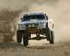 1998 Chevrolet C/K Pickup - This modified 1998 Chevrolet C/K Pickup truck is airborne during an off-road race.