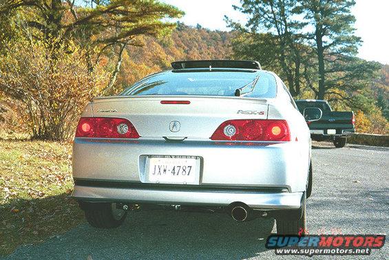 2006 Acura RSX-S rear view, license plate JXW-4787, with a dark pickup truck behind it