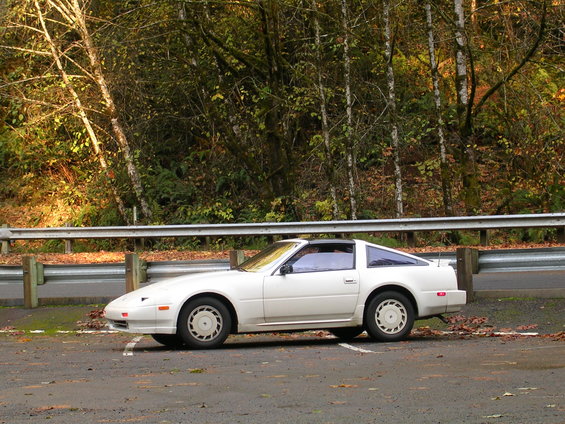 White 1989 Nissan 300ZX coupe parked curbside, side view