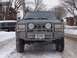1996 Jeep Grand Cherokee - A 1996 Jeep Grand Cherokee is parked on a snowy street, equipped with a heavy-duty front bumper and winch.