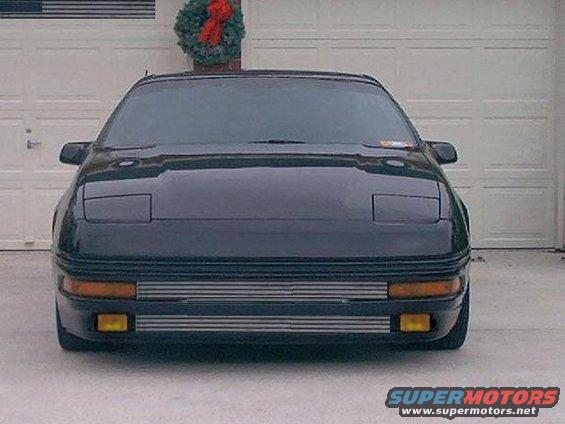 1996 Ford Probe front view, parked in front of a garage door with a wreath