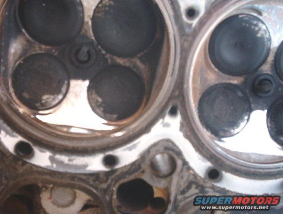 Close-up of an engine cylinder head with valves visible