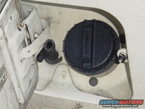 Fuel filler neck and cap with caution text