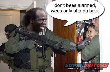 Man in tactical gear with face paint points a rifle at a scared child held by another man