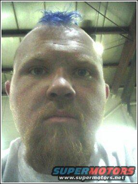 Guy with a blue mohawk and beard