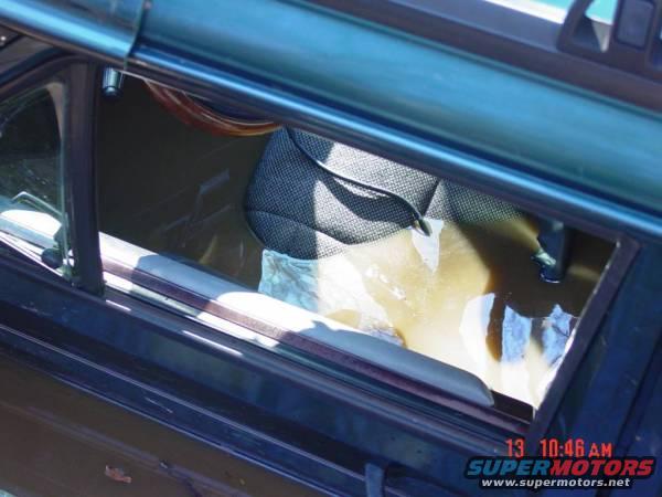 Interior of a vehicle with water damage, showing a seat and steering wheel