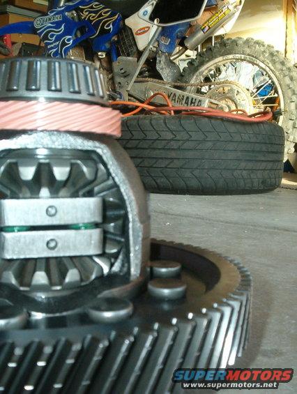 Differential gears with a dirt bike in the background