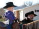 1982 Ford Bronco - A child and an adult, both wearing cowboy hats, are on horseback in front of a house.