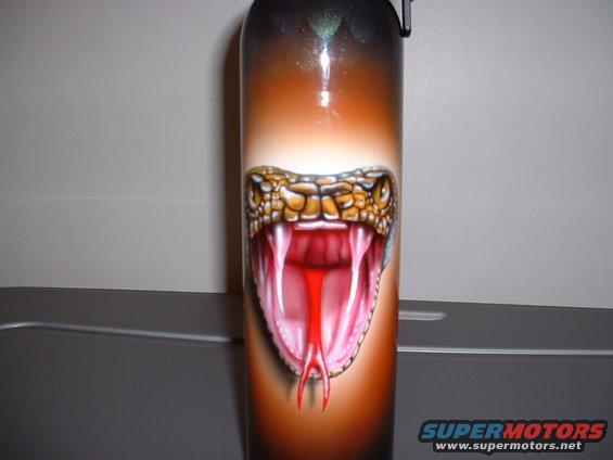 Cylindrical object with airbrushed snake head, orange and black gradient