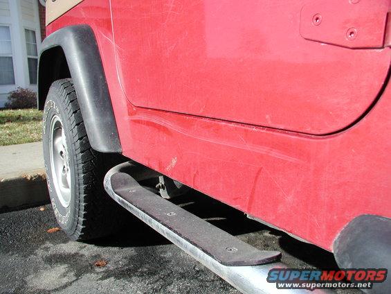 Red Jeep side panel with running board and fender flare