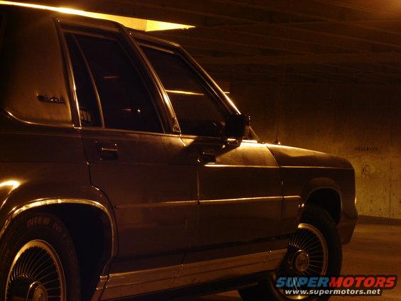 Side view of a 1988 Ford Crown Victoria LTD at night