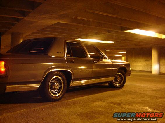 1988 Ford Crown Victoria LTD parked in a concrete garage at night