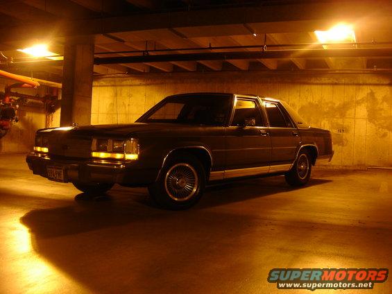 1988 Ford Crown Victoria LTD parked in a dimly lit garage