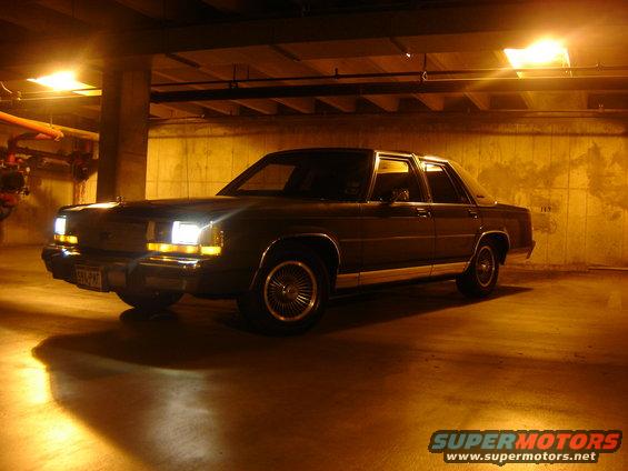 1988 Ford Crown Victoria parked in a dimly lit garage