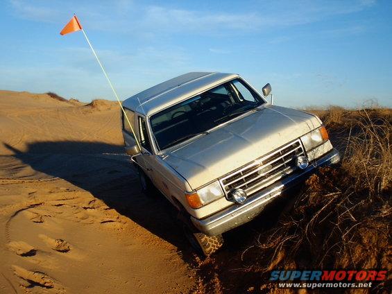 Unfortunately, I couldn't get back down with that back wheel in the air (no lockers yet).  But, at least I got to try out my new hi-lift.  After about an hour, we almost had the truck unstuck when some guys rode up on a couple four wheelers with winches and had me pulled out in no time at all.  After that it was getting dark so that's all the pics for now.  My new lights on the front work great in the dark though.