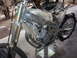 1999 Honda CR250R - This dirt bike is partially disassembled and mounted on a stand for work.