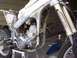 1999 Honda CR250R - This Honda dirt bike is partially disassembled, showing the engine and frame components.