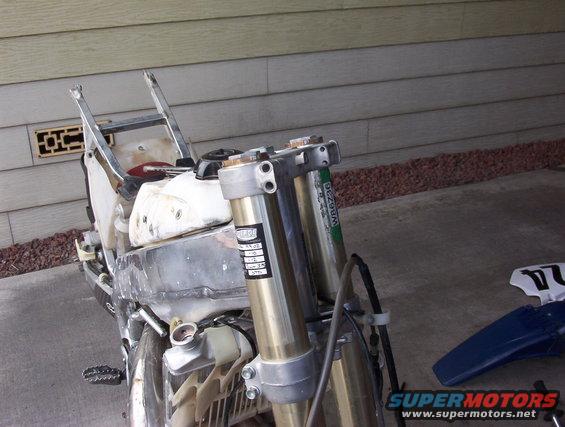 Dirt bike front forks and radiator, part of a disassembled motorcycle