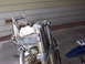 1999 Honda CR250R - Front end of a disassembled dirt bike, showing suspension forks and radiator.