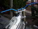 1999 Honda CR250R - Close-up view of a dirt bike's handlebars and fuel tank, with a radiator in the foreground.