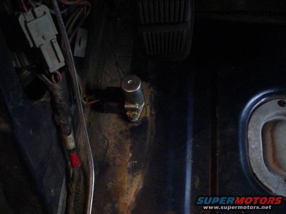 Dashboard wiring and a metal cylinder component with wires attached