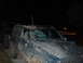 1996 Jeep Cherokee - Two muddy Jeeps are parked side-by-side at night, with one showing a heavily damaged windshield.