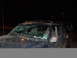 1996 Jeep Cherokee - A muddy 1996 Jeep Cherokee with a damaged windshield is seen at night, with another vehicle partially visible behind it.