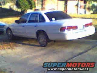 White 1997 Ford Crown Victoria, rear 3/4 view