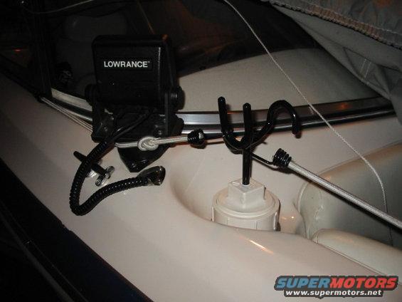 Front rod holder made from pvc pipe and end cap with rod holder screwed into the top. It sits in a regular drink holder and is tall enough to reach over the side.