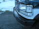 1994 Ford Bronco - Close-up of the front grille and headlight assembly on a 1994 Ford Bronco.