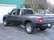 1994 Ford Bronco - Gray Ford Ranger pickup truck with black trim and fender flares parked in a driveway.