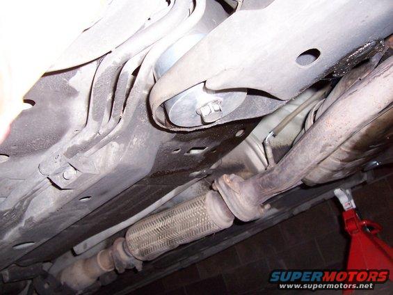 Underside view of vehicle exhaust system and suspension components