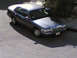 1999 Mercury Grand Marquis - This 1999 Mercury Grand Marquis sedan is captured from a high angle, showing its front three-quarter view.