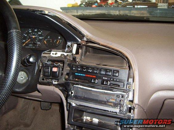 1993 Mazda MX-6 interior with dashboard disassembled, showing radio and climate controls removed