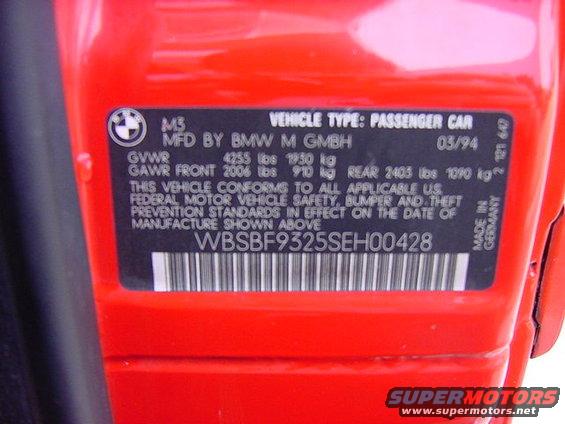 VIN plate on red BMW M3, manufactured 03/94. VIN is WBSBF9325SEH00428