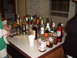 1988 Ford Bronco - A large selection of alcoholic beverages are displayed on a countertop, ready for a gathering.