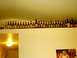 1996 Ford Probe - A collection of beer bottles displayed on a shelf above a wall.