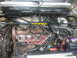 1983 Volkswagen Scirocco - Engine bay details, including a strut bar and battery, are shown in this photograph.