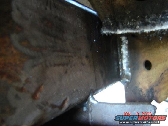 Welded metal frame with rust and a date stamp of JAN 3 2006