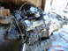 1982 Nissan Titan - Engine and transmission assembly, likely from a Nissan vehicle, with visible hoses and belts.